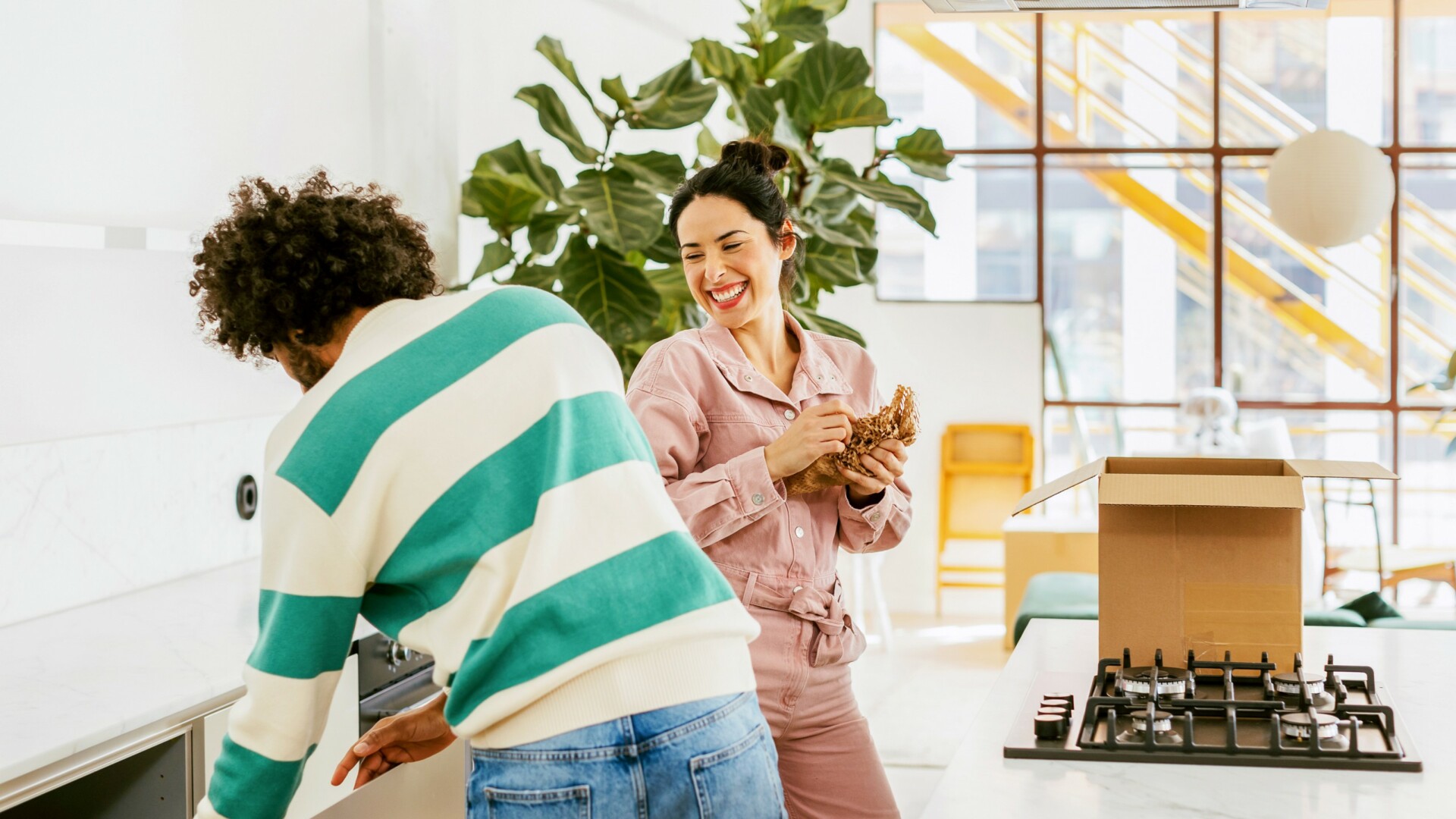 Young couple moving into their kitchen