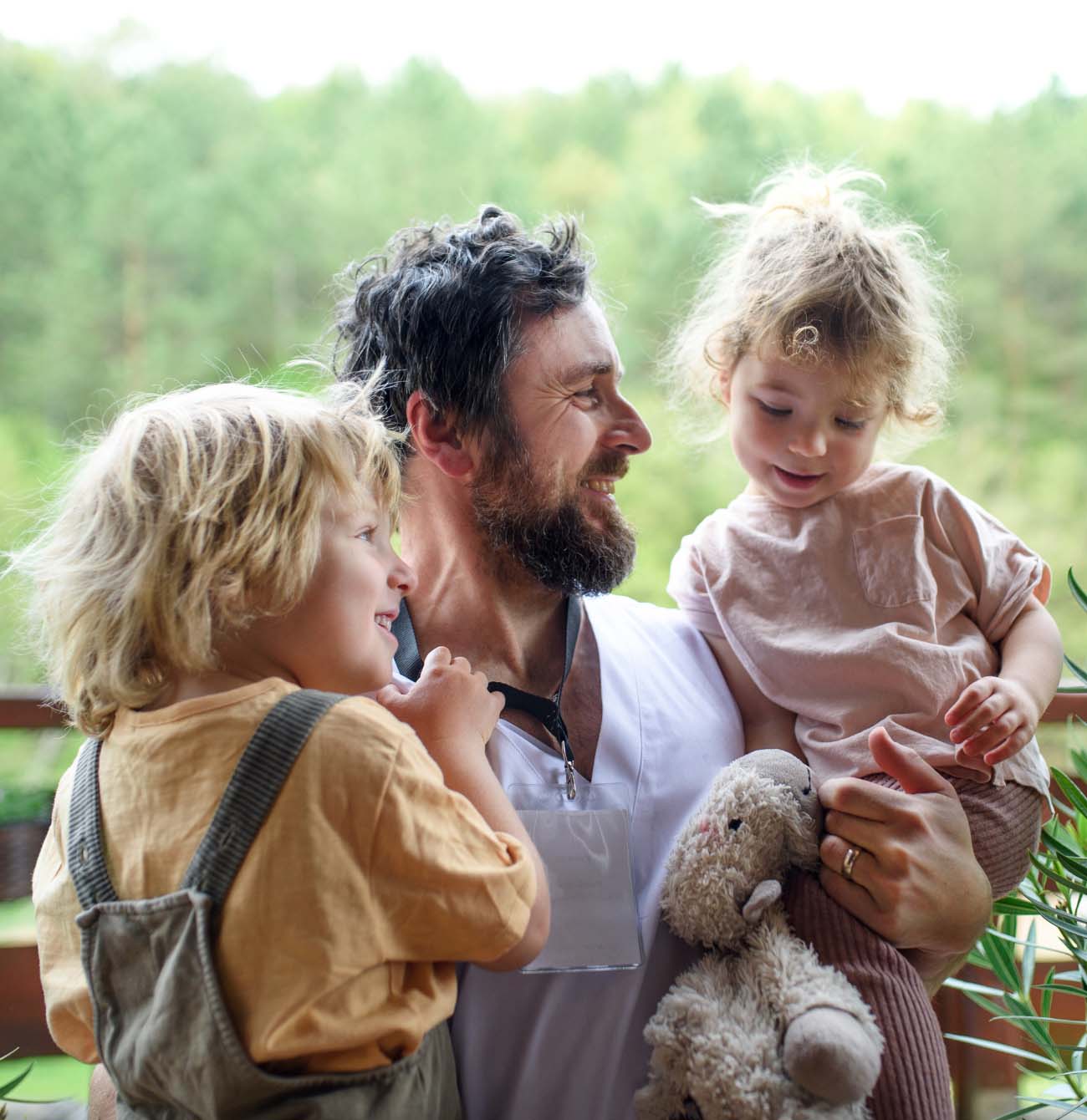 Young father holding his children