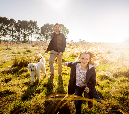 Arcadia, Officer father holding dog and walking with daughter