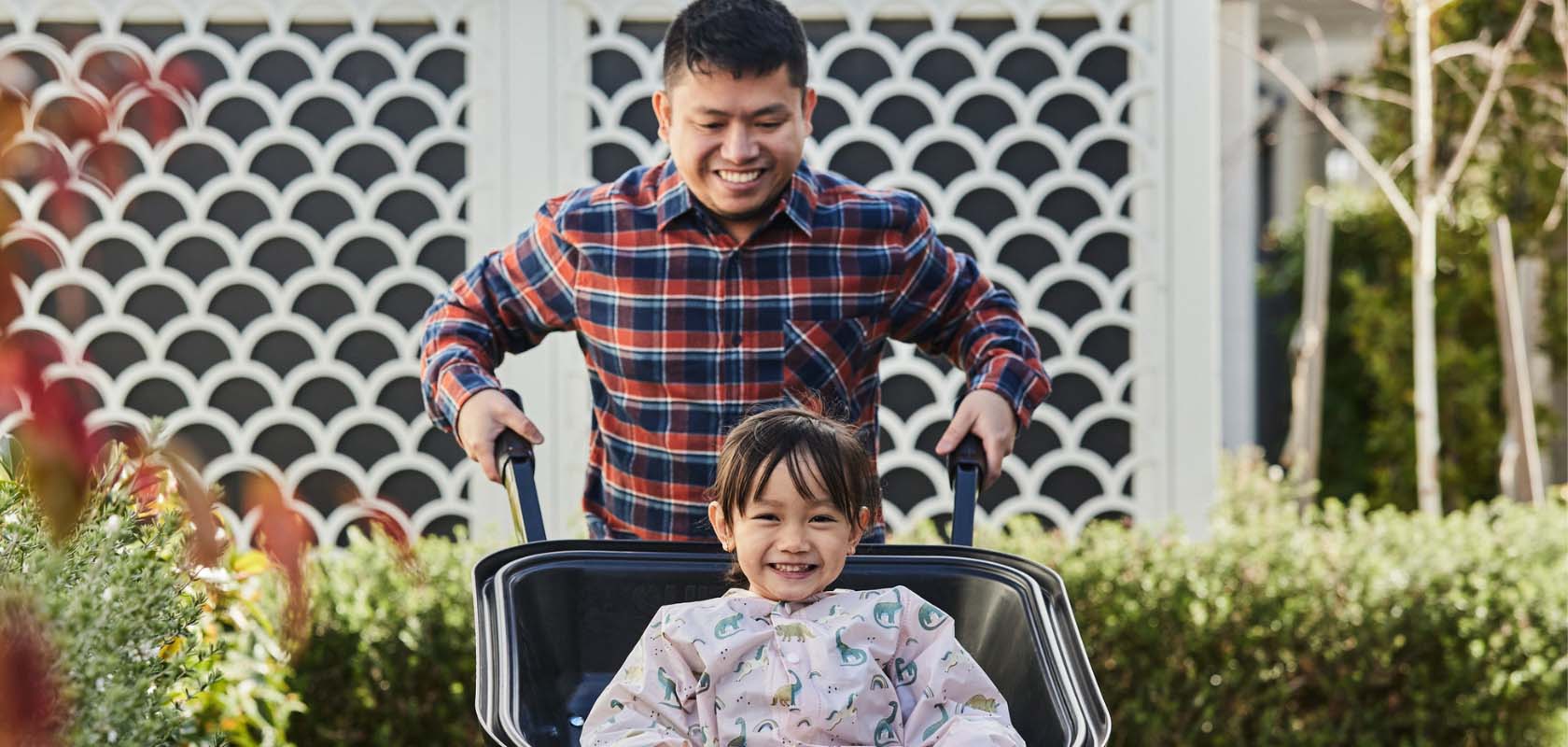 Botanical, Mickleham father pushing daughter in wheelbarrow v2.