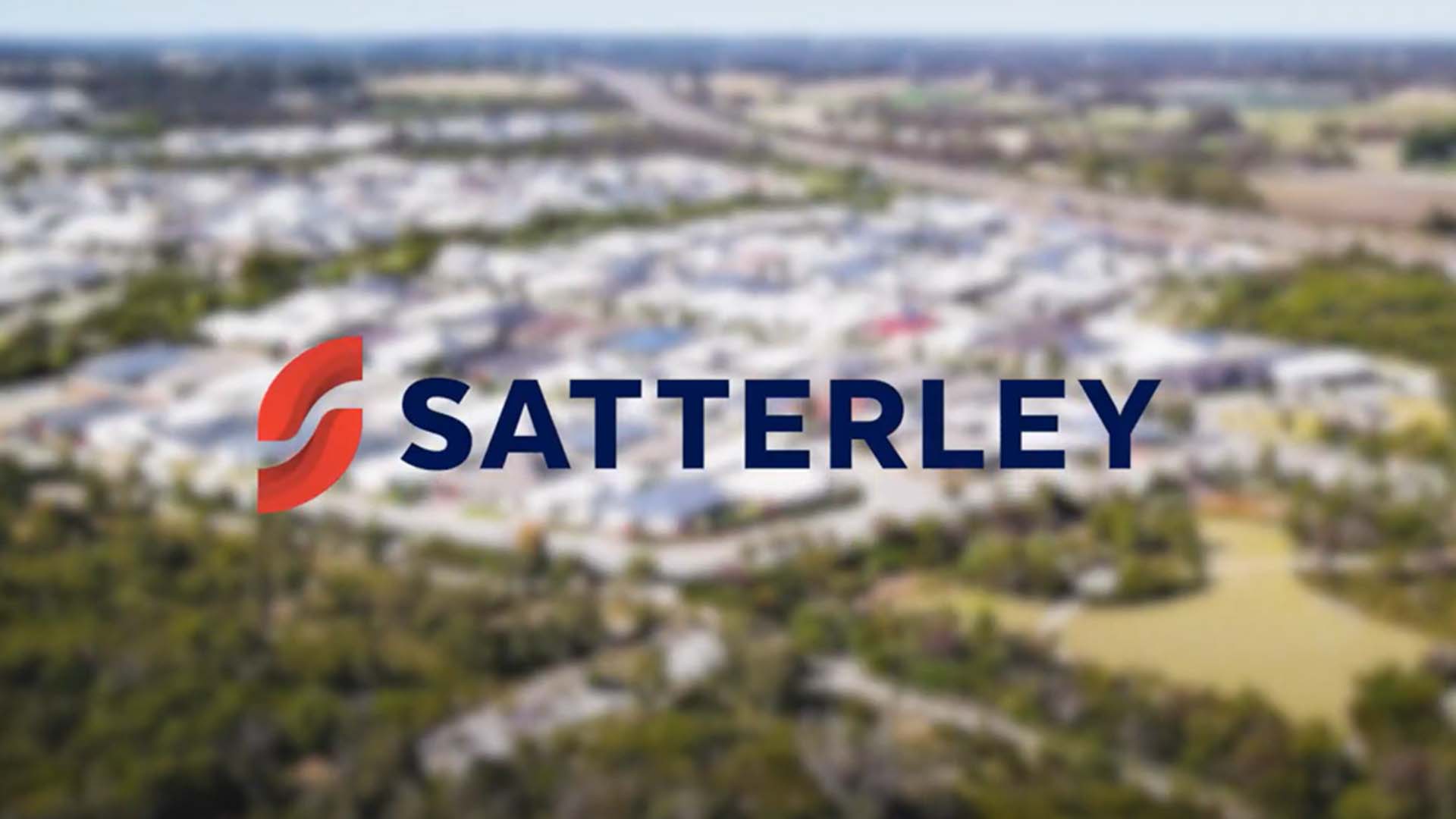 Satterley logo over aerial view of community