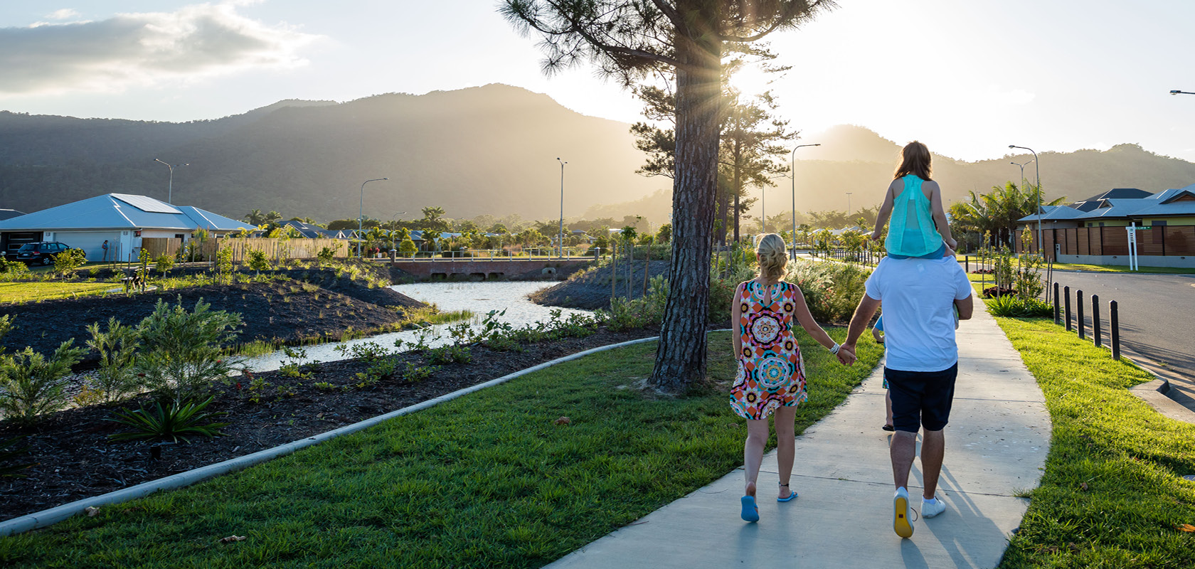 Smithfield Village, Smithfield nature walk with ,young family walking away from the camera.