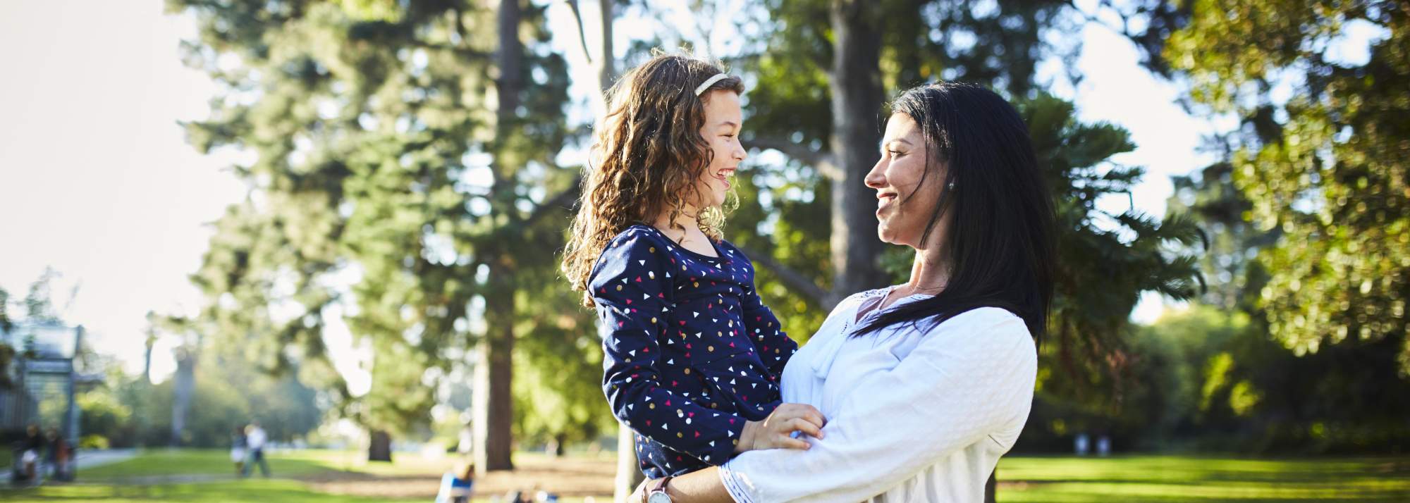 Mother and daughter standing outside in Mickleham