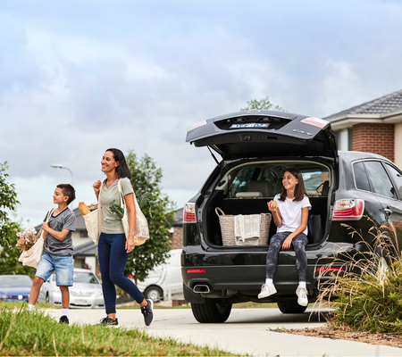 Heartford, Donnybrook mother and children unpacking food shopping from the car.
