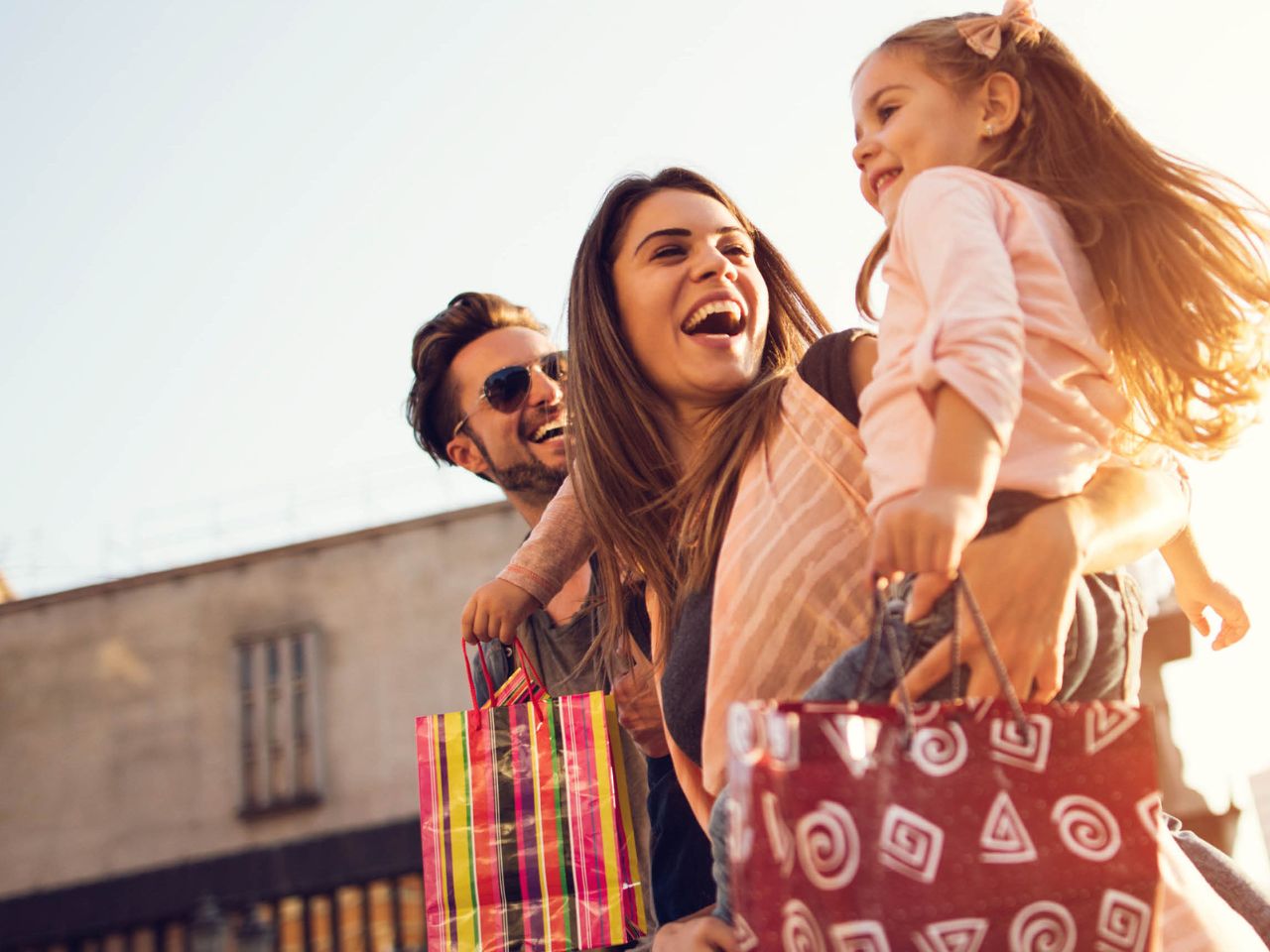 Catalina, Mindarie and Clarkson father, mother holding daughter at the shops