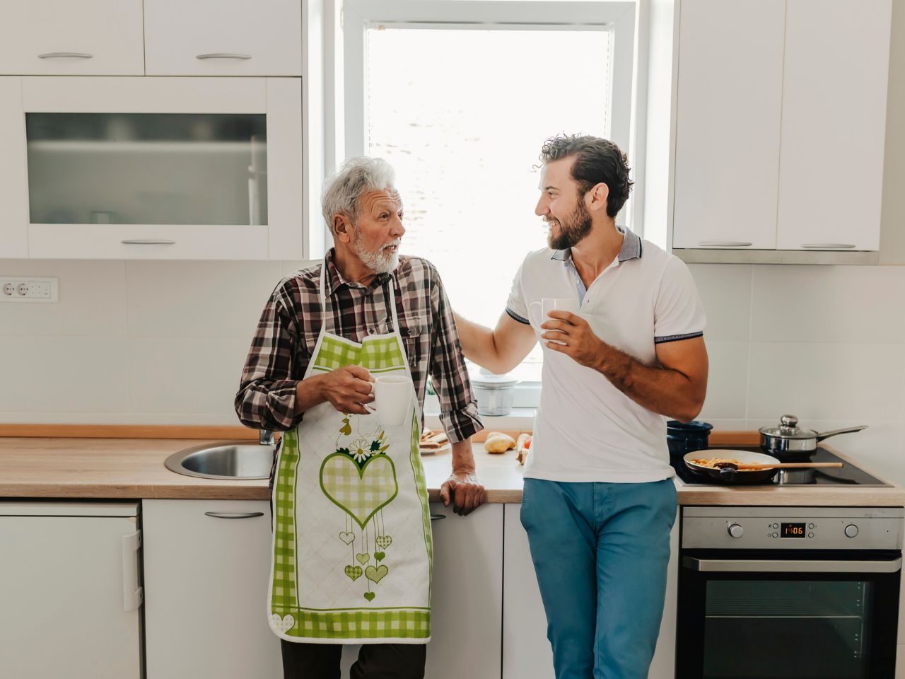 Gallery, Willagee, elderly father and son cooking in the kitchen