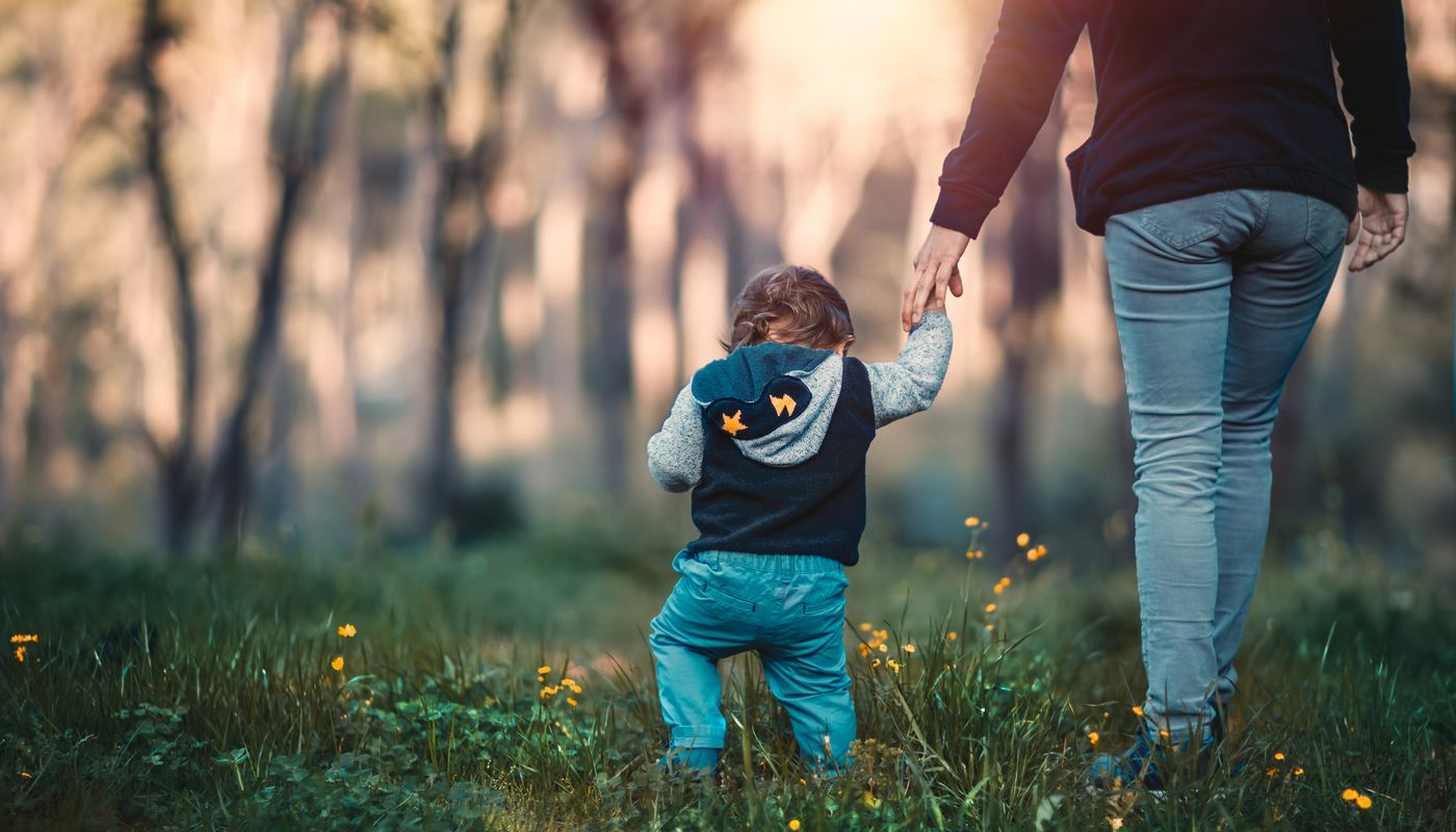 Young mother and child walking in the park in Bunbury