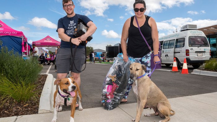 Allara, Eglinton husband and wife holding leads for two medium sized dogs at local event.