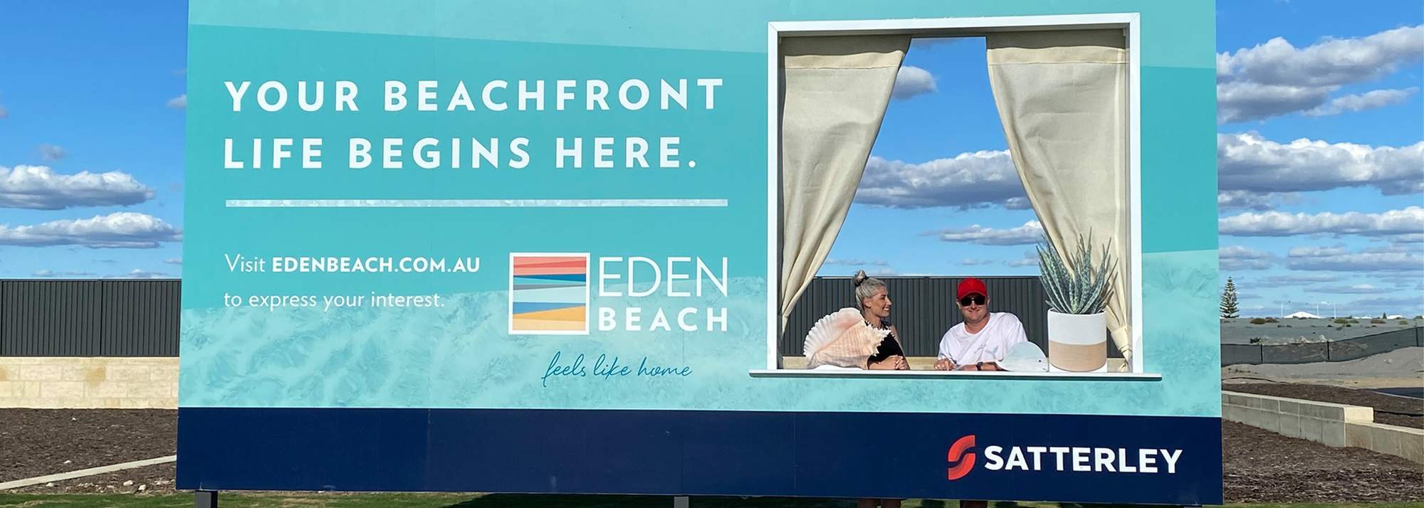 Eden Beach, Jindalee, young couple taking photo in the beachside frame