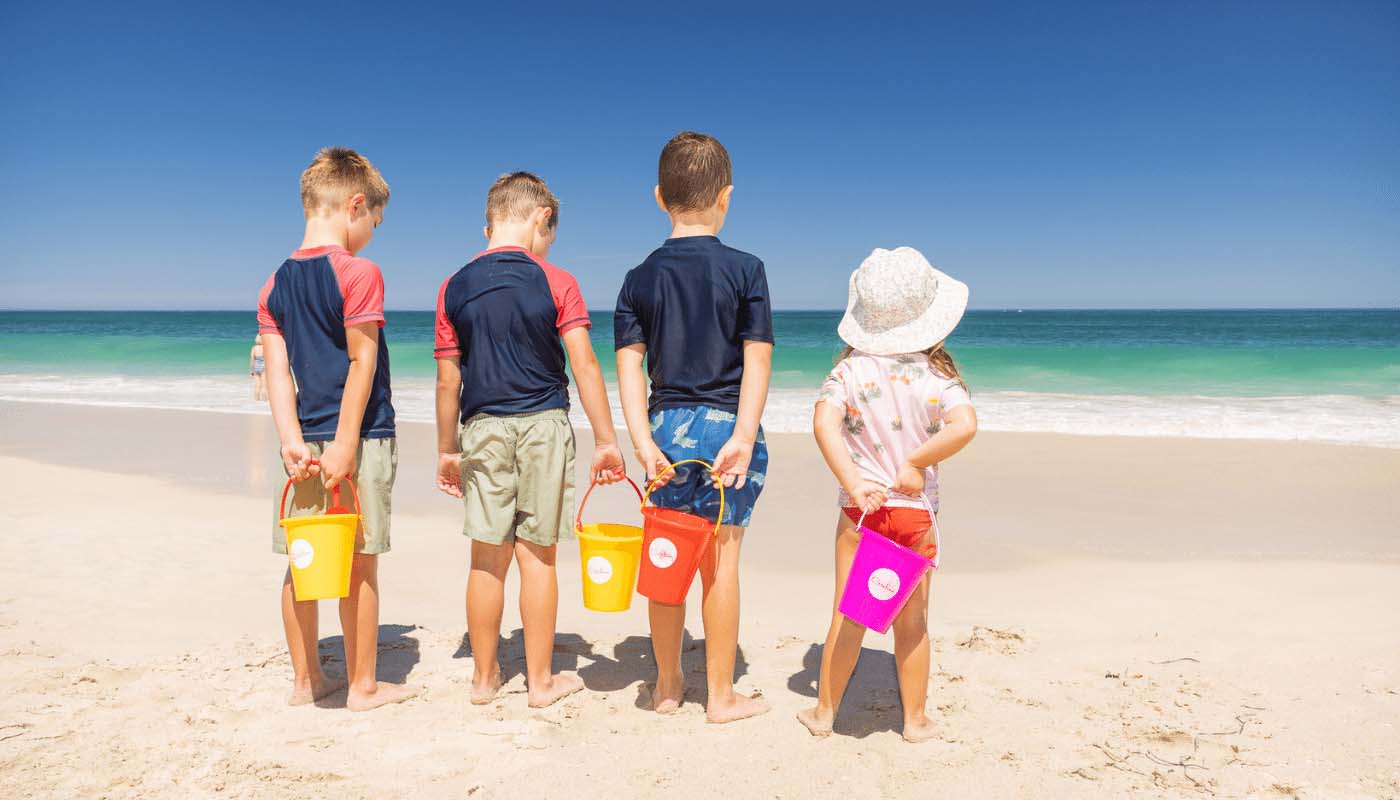 Mindarie beach access children standing in front of the water