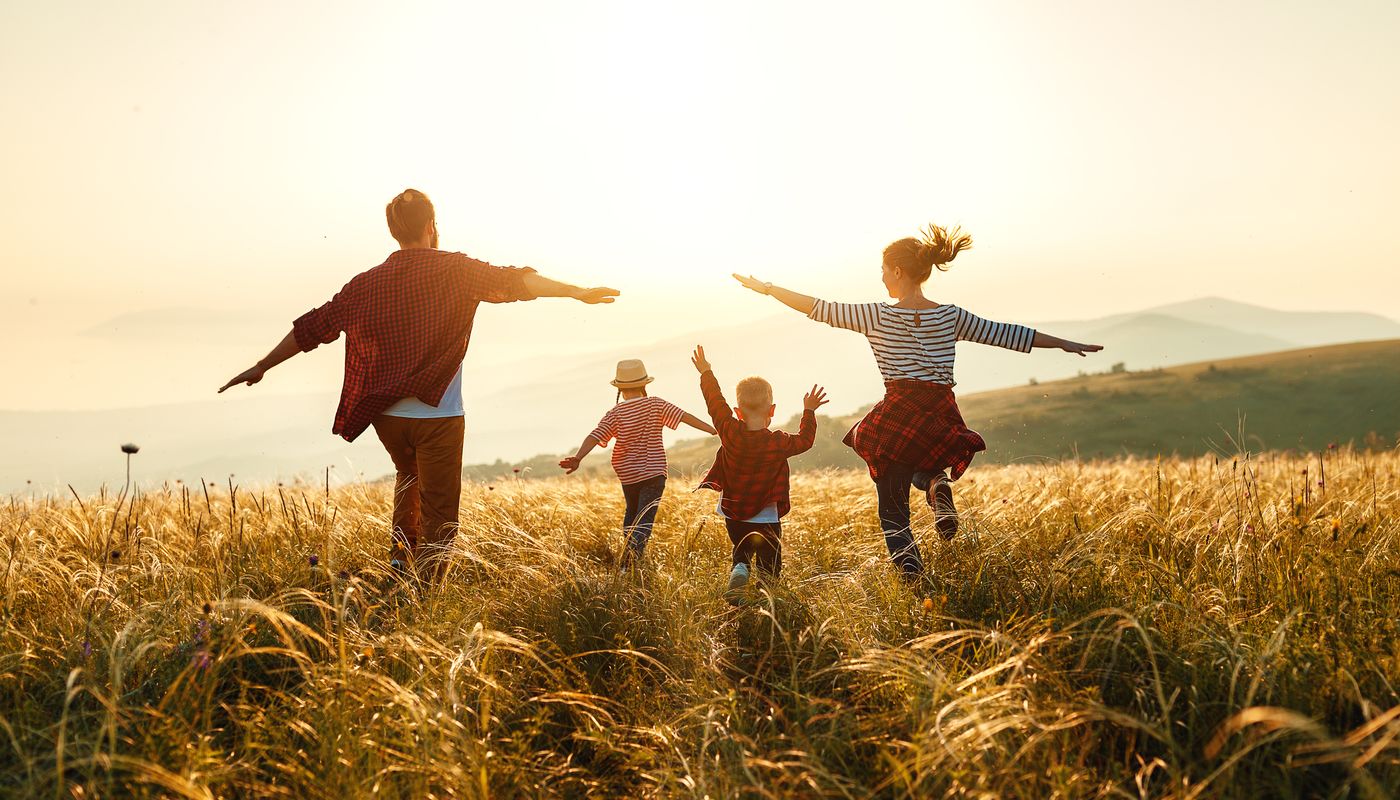 Cassia, Kwinana young family running across the park, with their arms extended out like aeroplanes