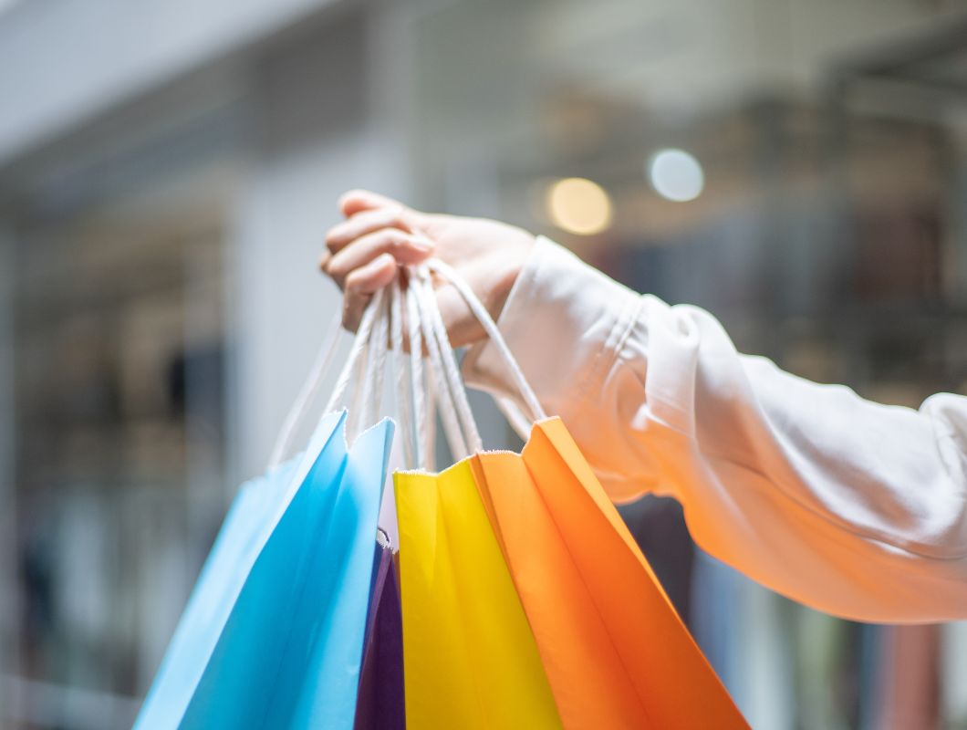 Woman shopping at local shopping centre.