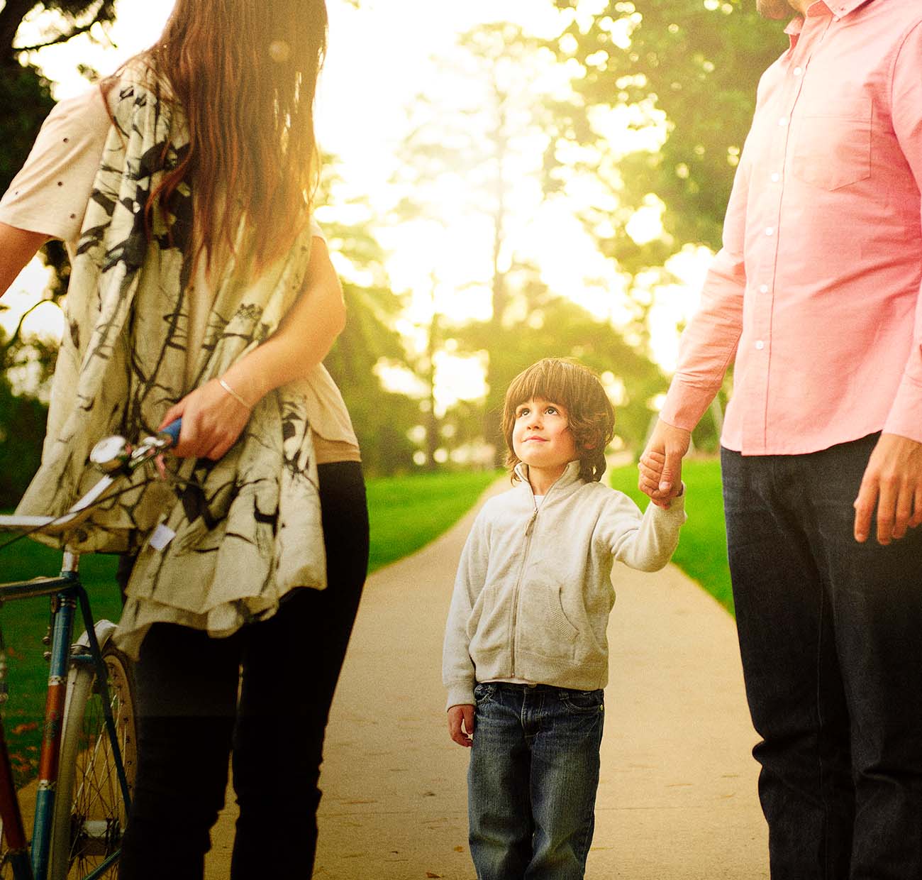 Young couple with child walking outdoors
