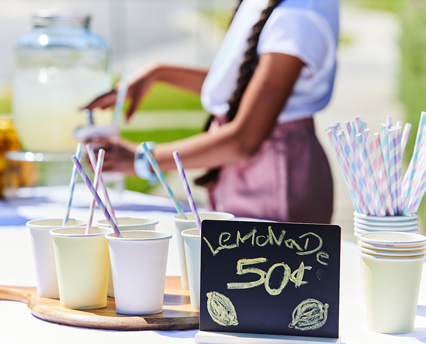 Maple Grove, Pakenham lemonade stand with paper cups and sign.