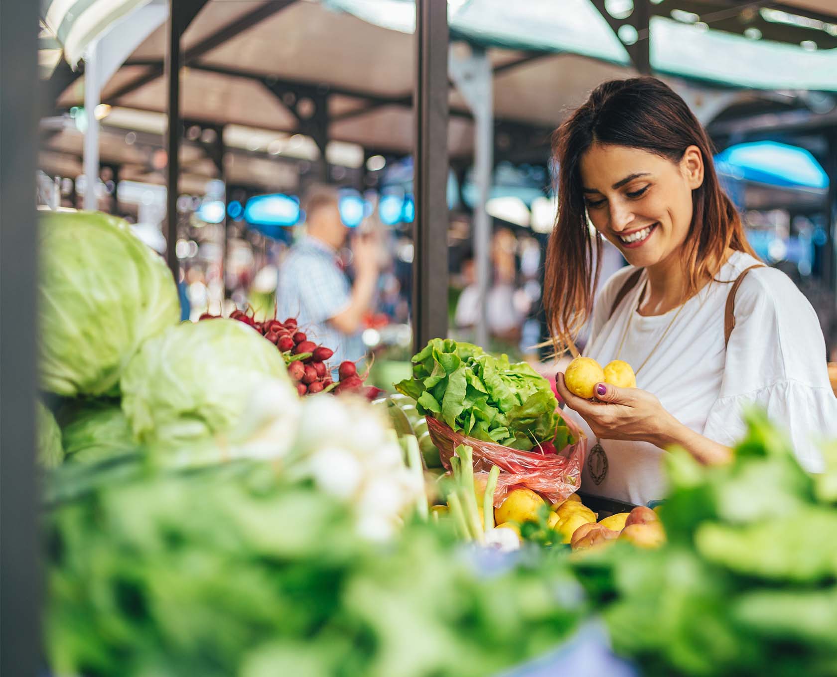 Young woman selecting fruit and vegetables