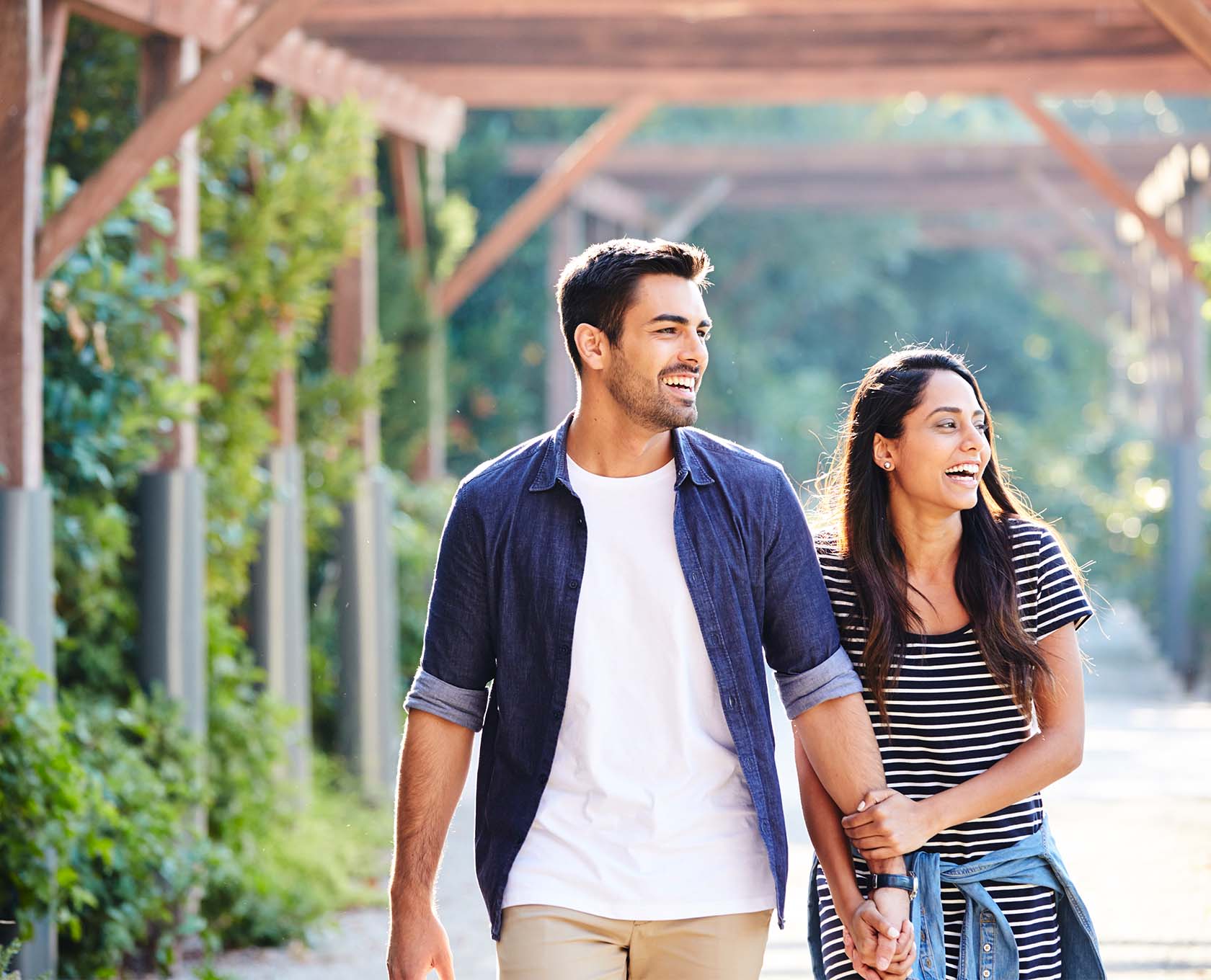 Young couple walking and laughing