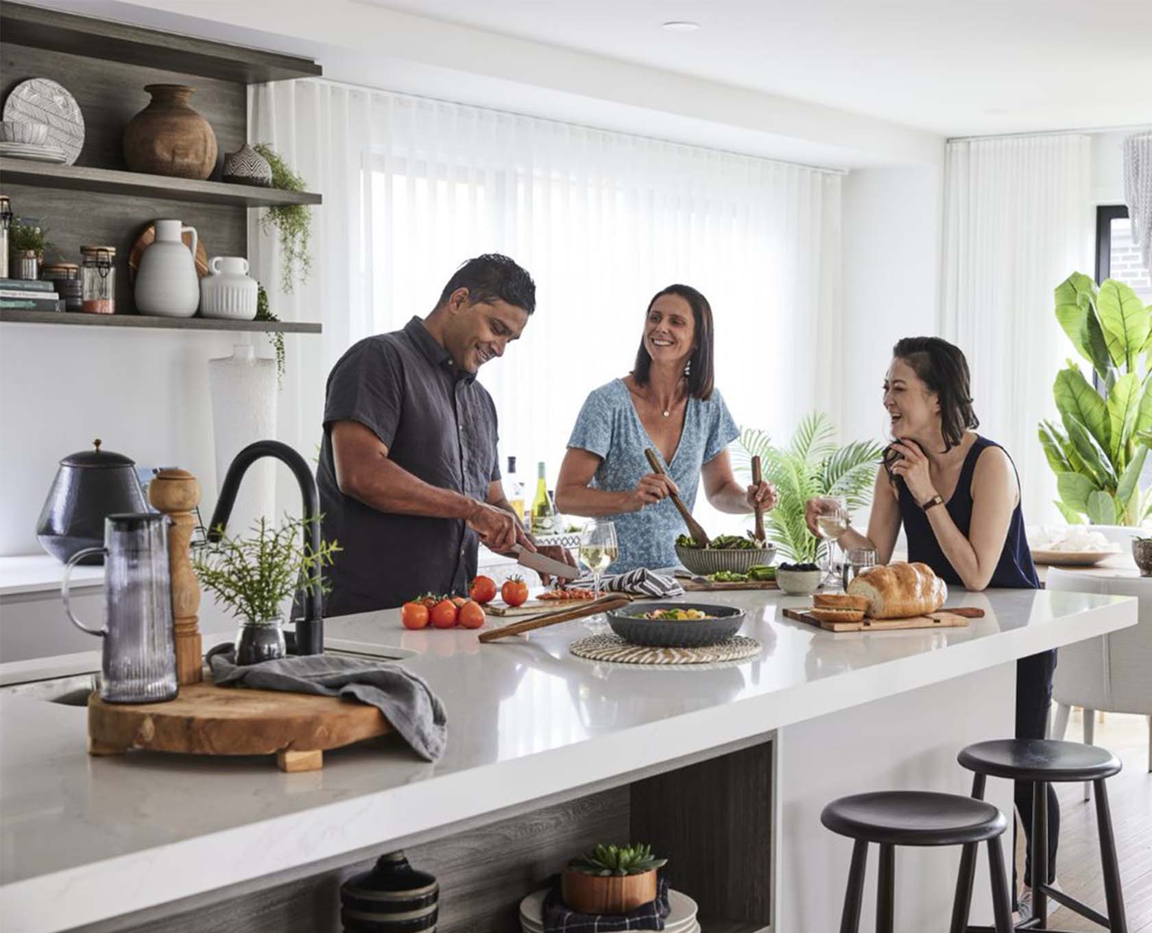 Friends enjoying their new kitchen