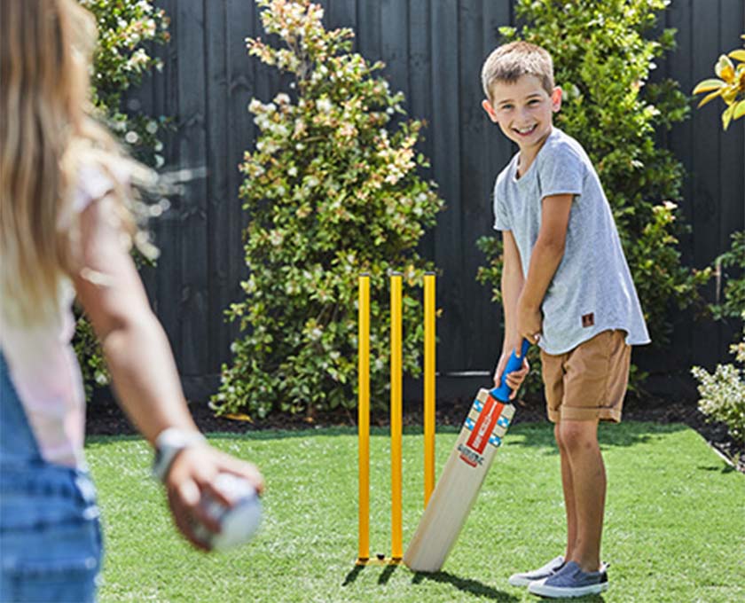 Maple Grove, Pakenham young children playing backyard cricket v3.