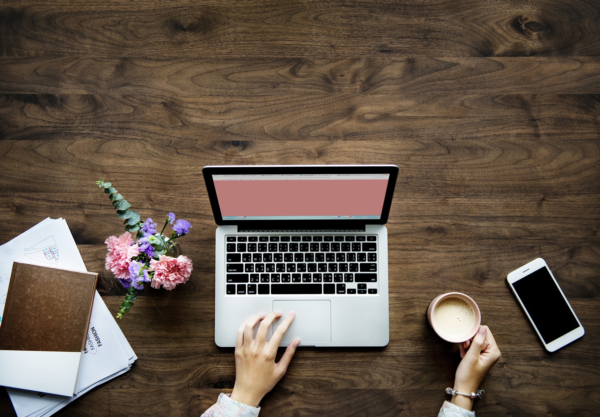 Lady with laptop and coffee ready to start her day