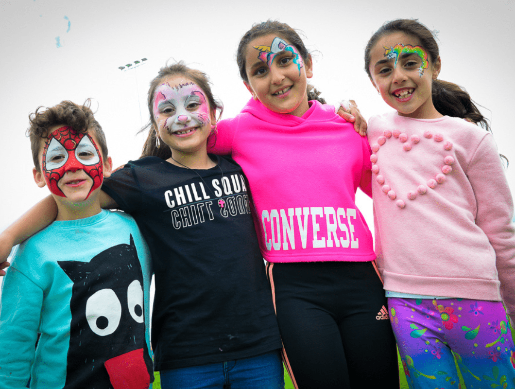 True North, Greenvale community event, children with their face painted.