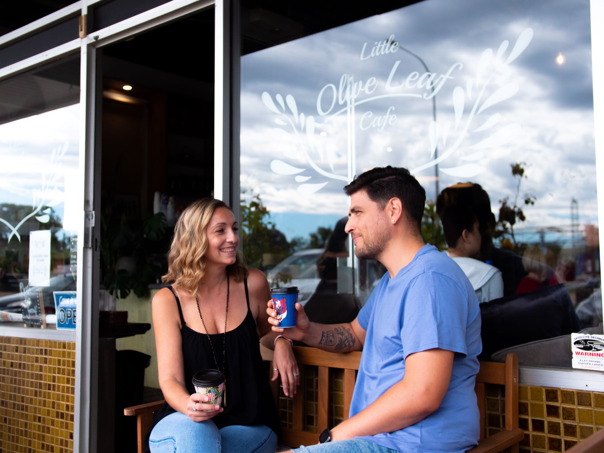 Gallery, Willagee, young couple enjoying a coffee outside of local coffee shop