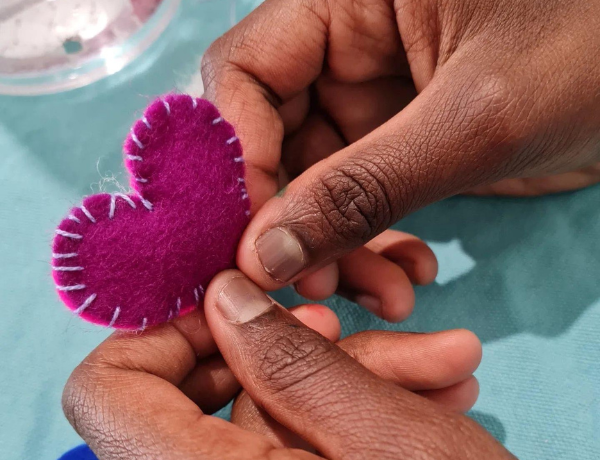 Seaside school holidays activation program sewing hearts