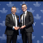 Sandy accepting award for Beaumaris Beach