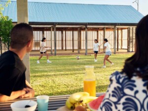 Family kicking the soccer ball in Clementine in Upper Swan