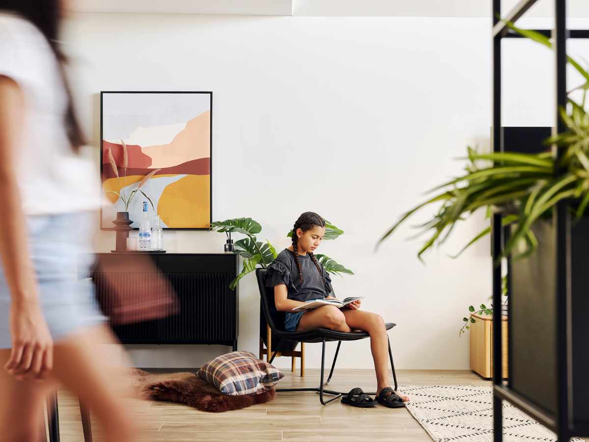 Young teenager reading book in new home at Clementine in Upper Swan