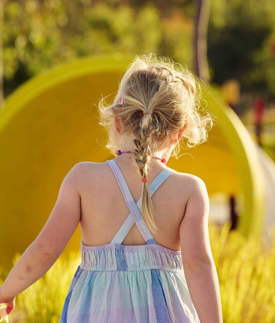 Young child walking around the play equipment at Clementine, Upper Swan