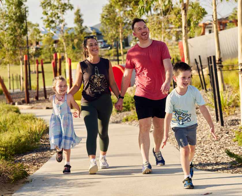Young family walking through Clementine estate in Upper Swan