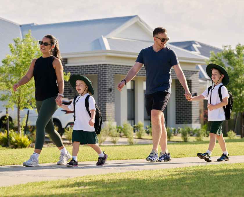 Young family walking to school at Clementine estate