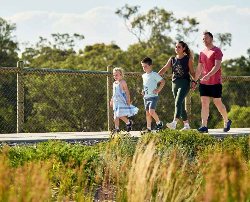 Young couple walking with their children at Clementine in Upper Swan
