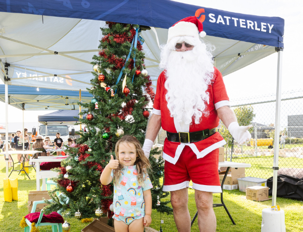 Allara community Christmas Santa with young child