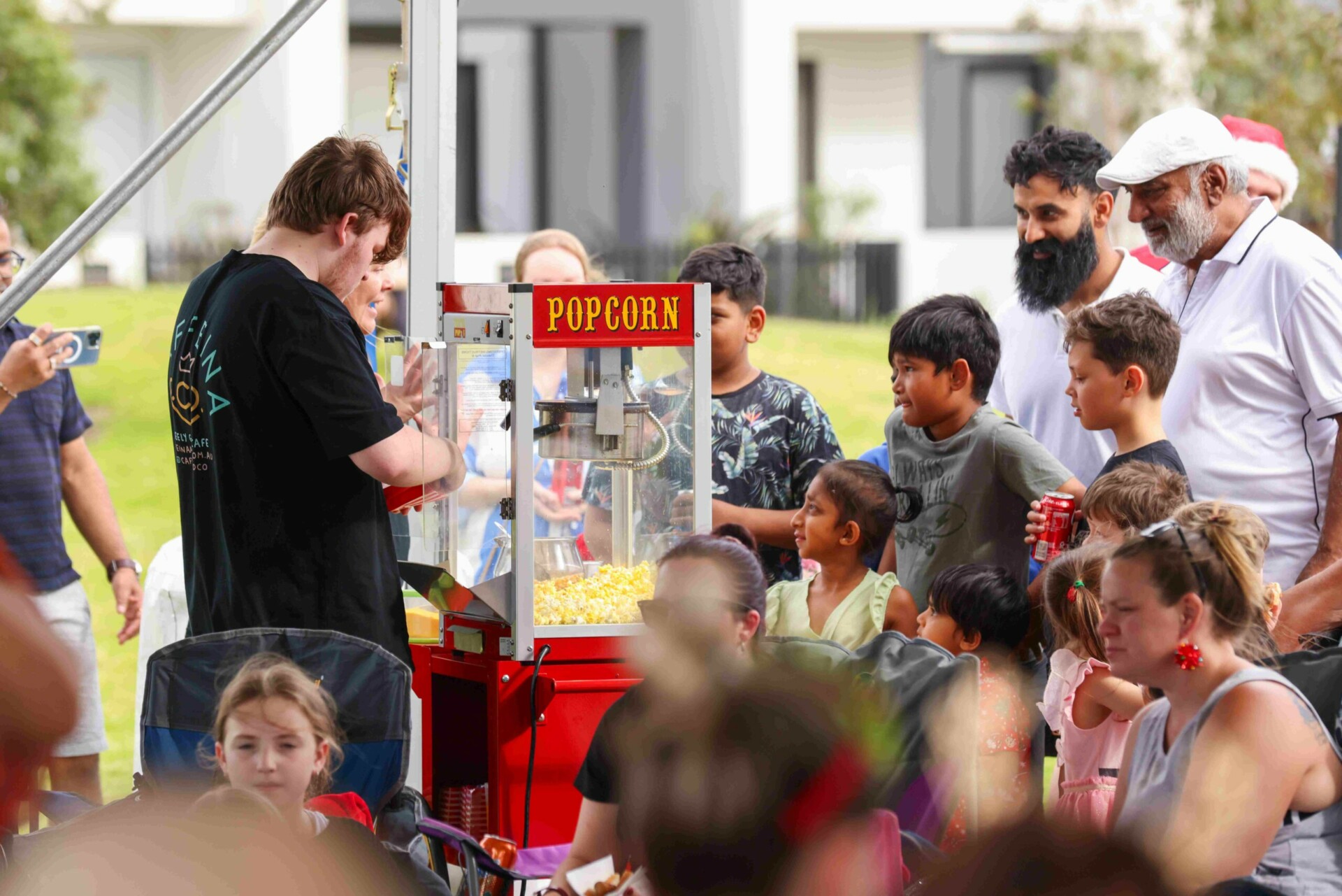 Arcadia Christmas movie night families enjoying the pop corn