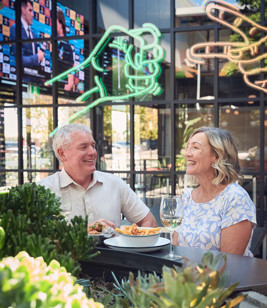 Seaside, Madora Bay older couple enjoying lunch