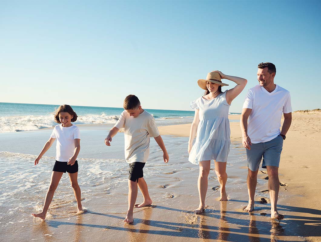 Seaside, Madora Bay young family walking along the beach