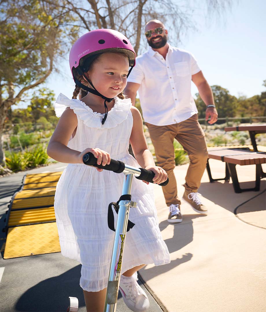 Allara, Eglinton father watching young daughter ride scooter