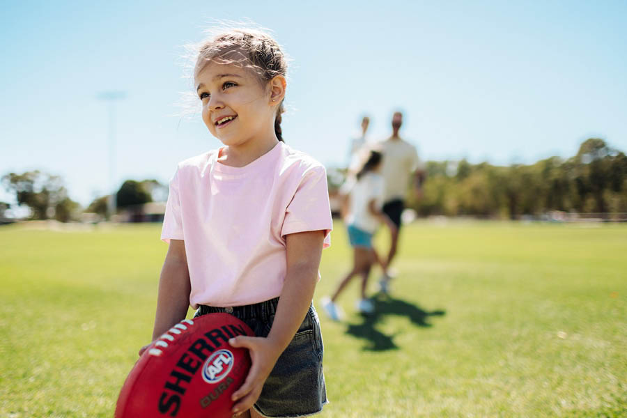 The Glades, Byford young girl kicking the football