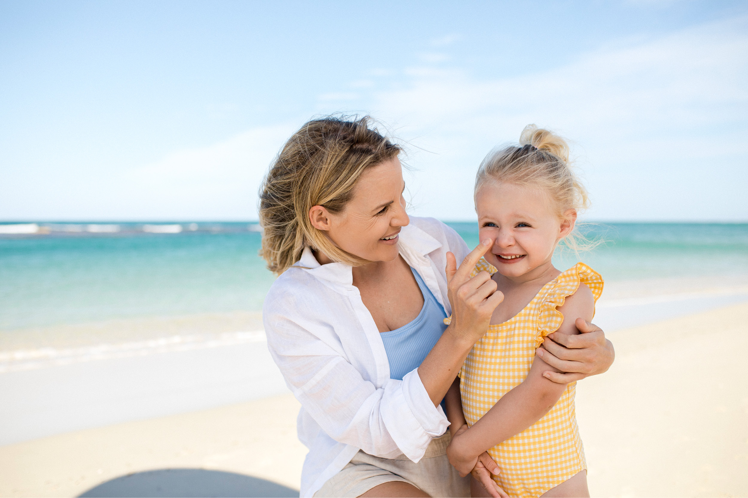 Vertex, Yanchep mother putting sunscreen on daughter