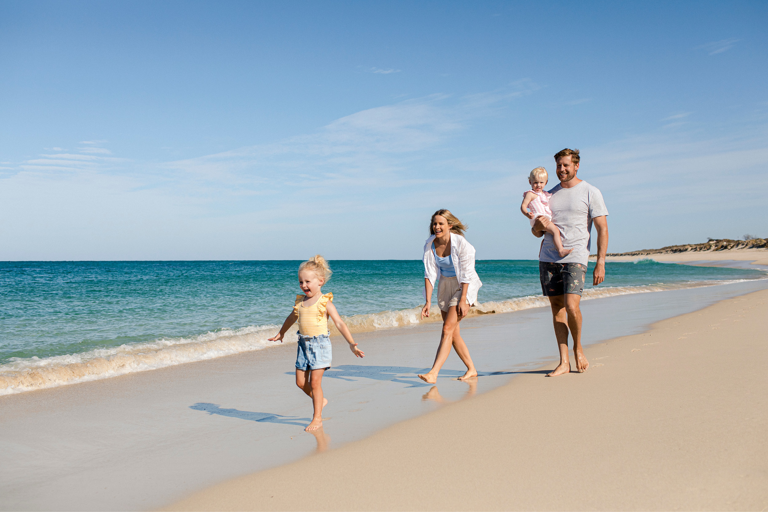 Vertex. Yanchep young family walking along the coast line