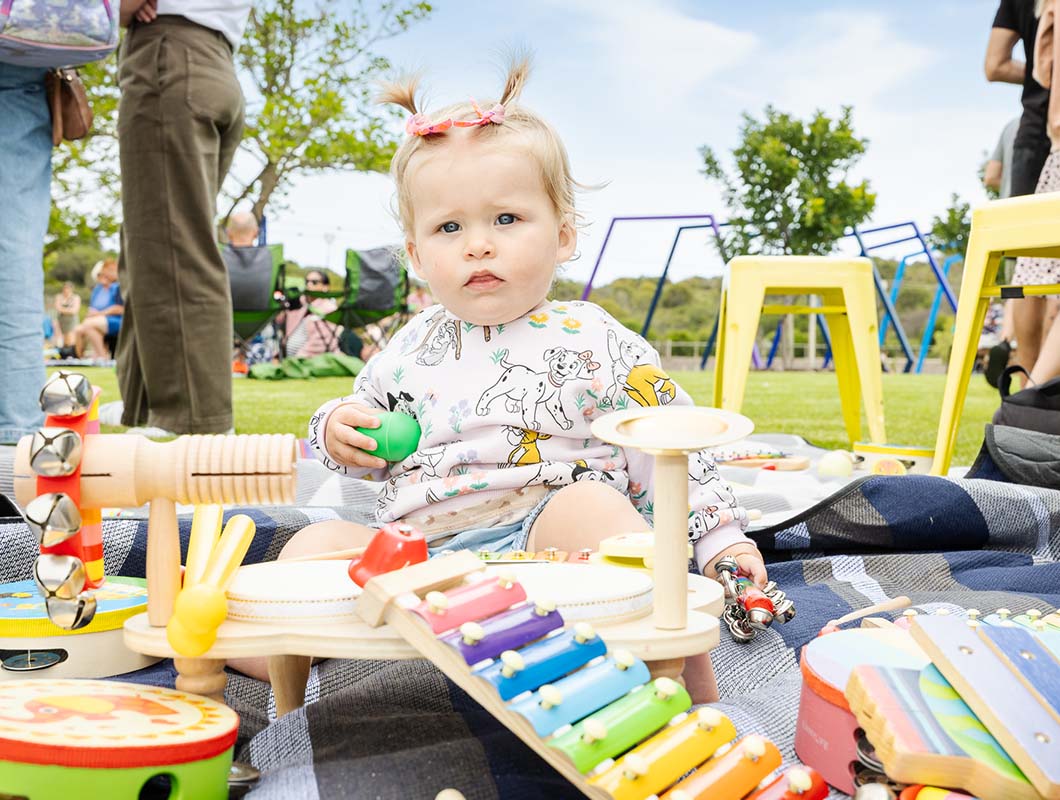 Catalina park event, young child with musical toys